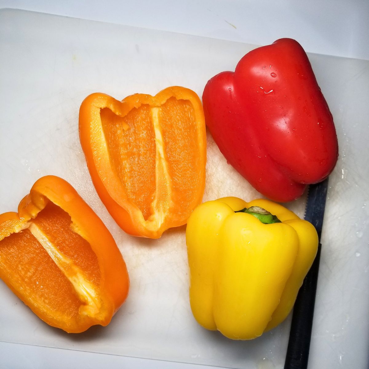 Red, yellow, and orange bell peppers.