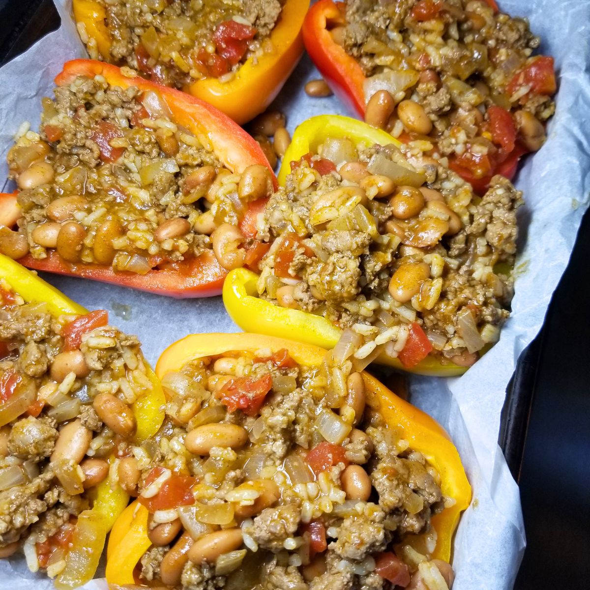 Taco filling stuffed inside bell pepper halves.