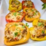 Taco Stuffed Bell Peppers in a white baking dish.