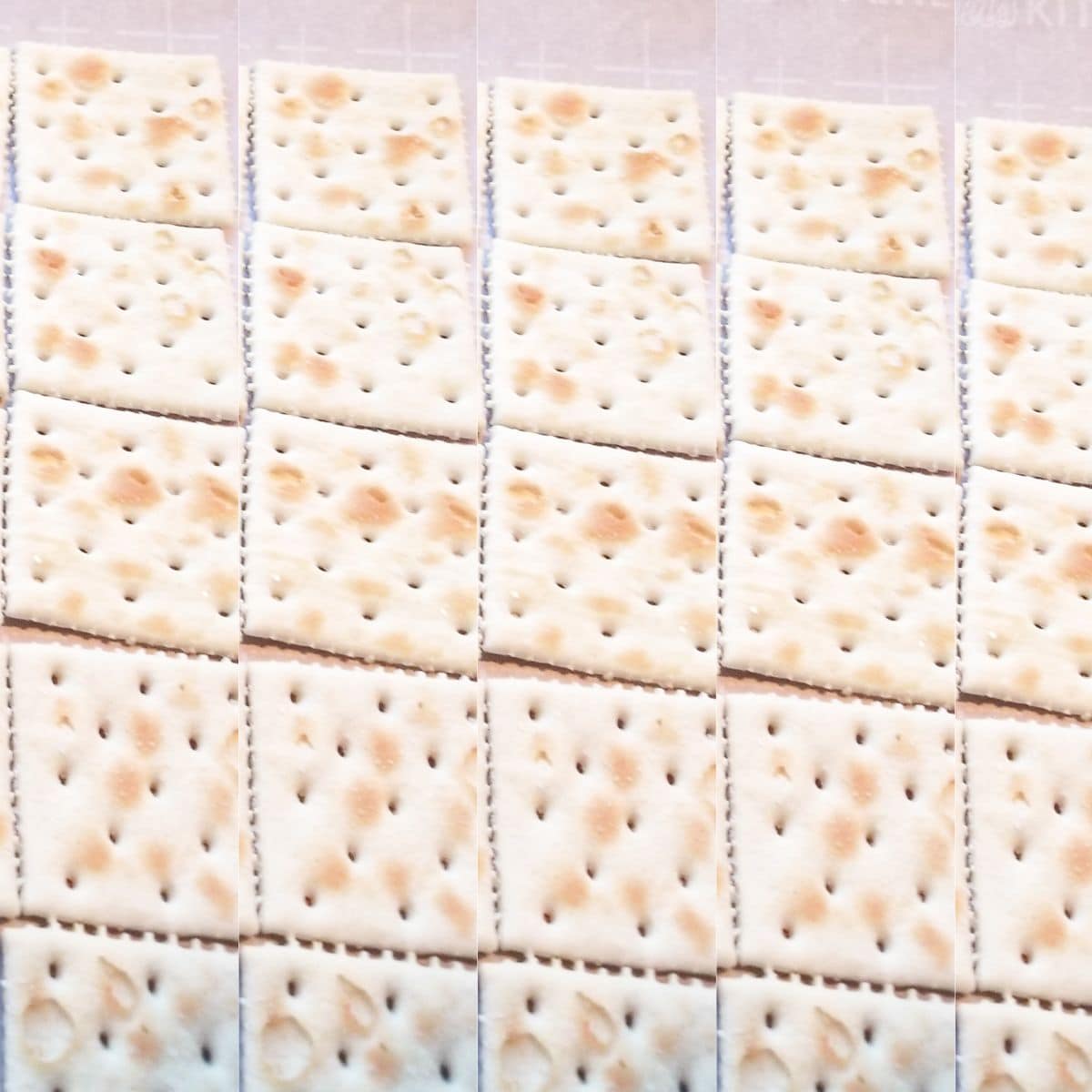 Saltine crackers on a baking sheet.