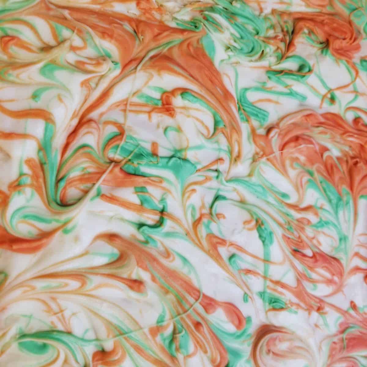 White chocolate saltine toffee with red and green swirls.