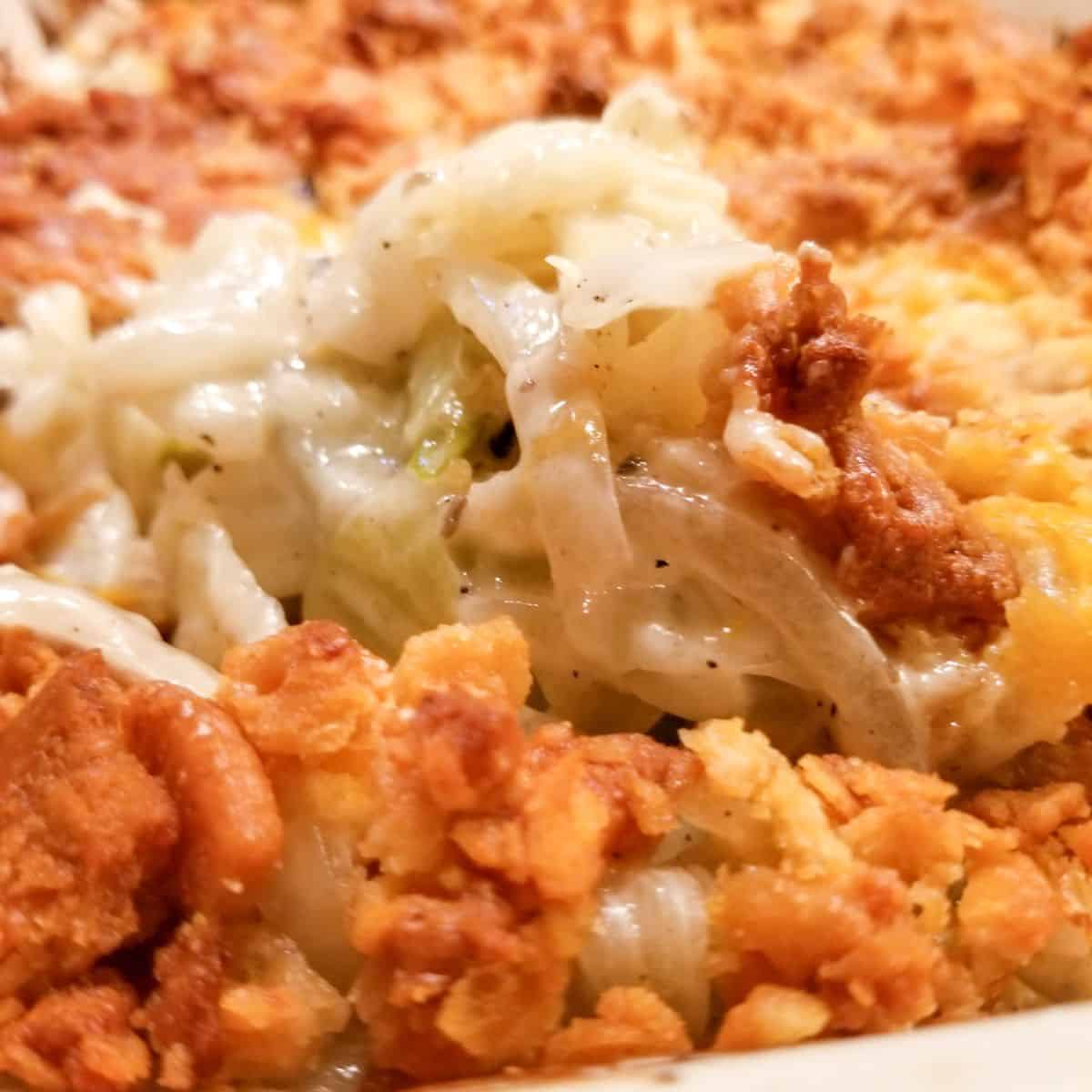 Cabbage casserole in a baking dish with a crunchy topping.