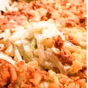 Cheesy cabbage casserole in a baking dish.