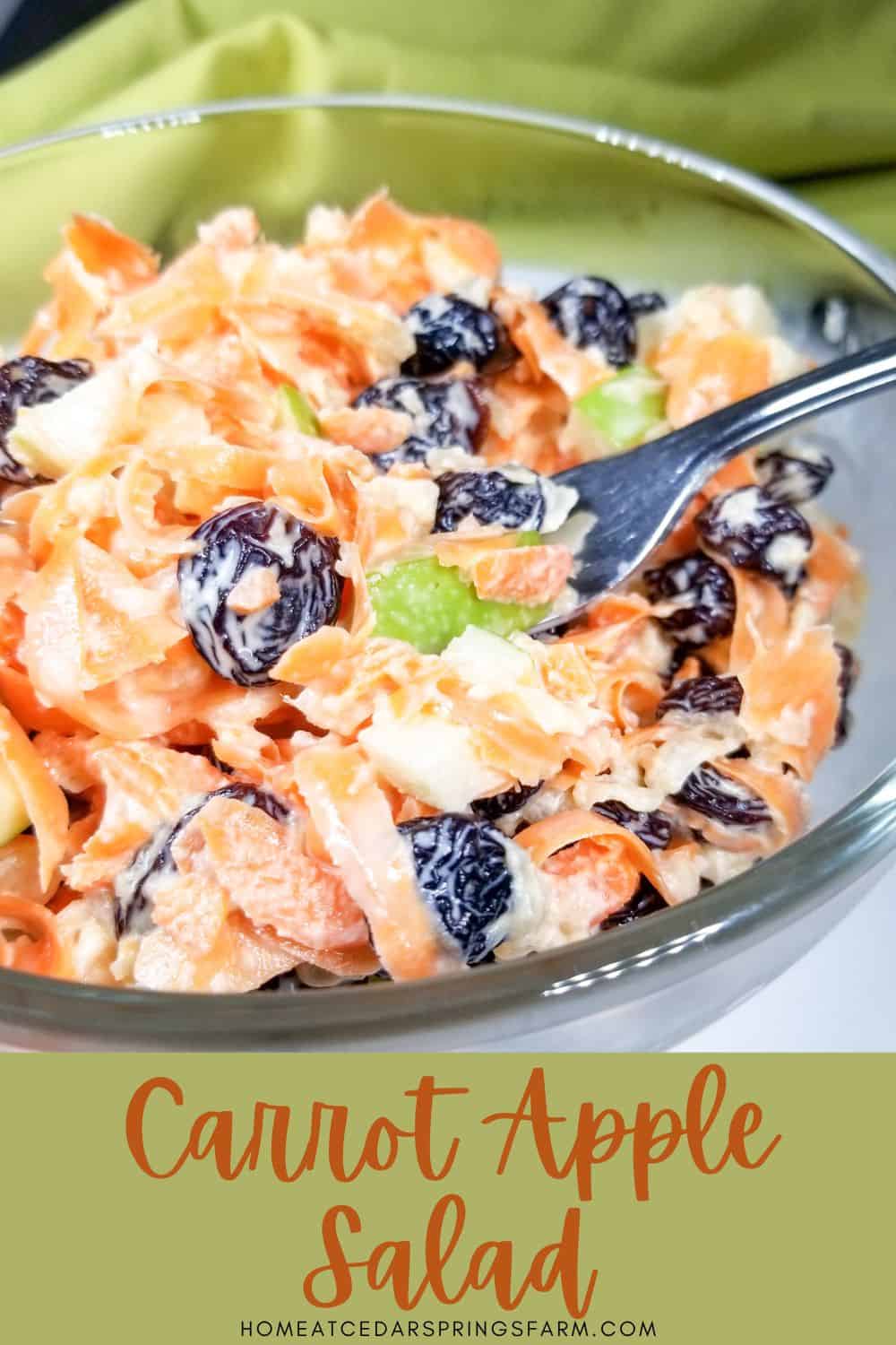 Carrot Apple Salad in a bowl with a fork.