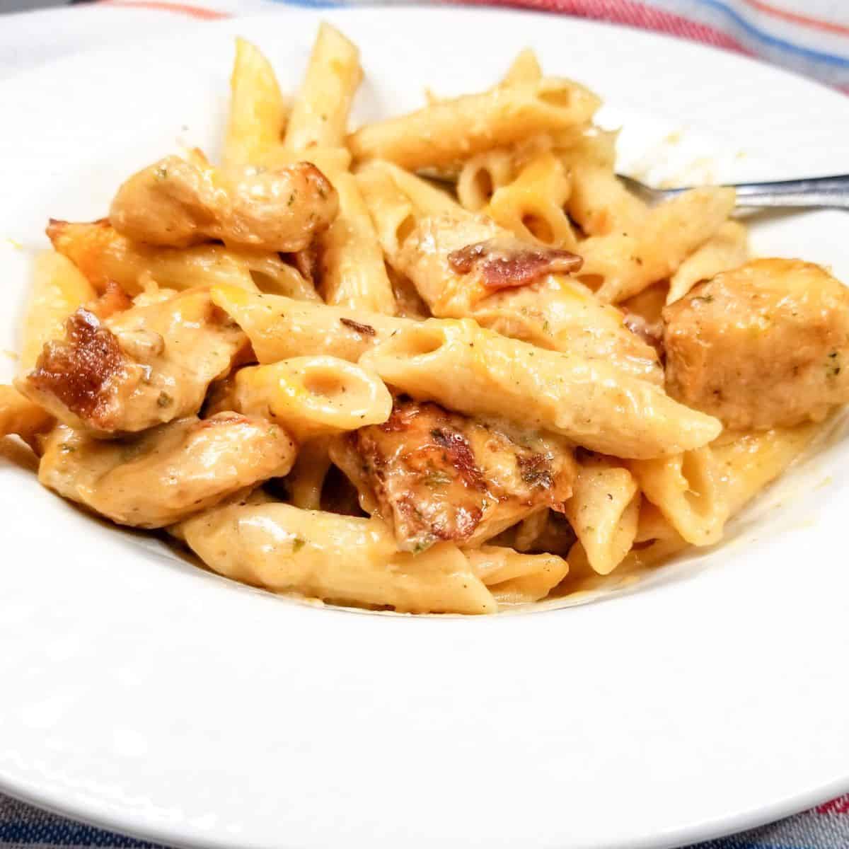 Chicken ranch pasta in a serving bowl.