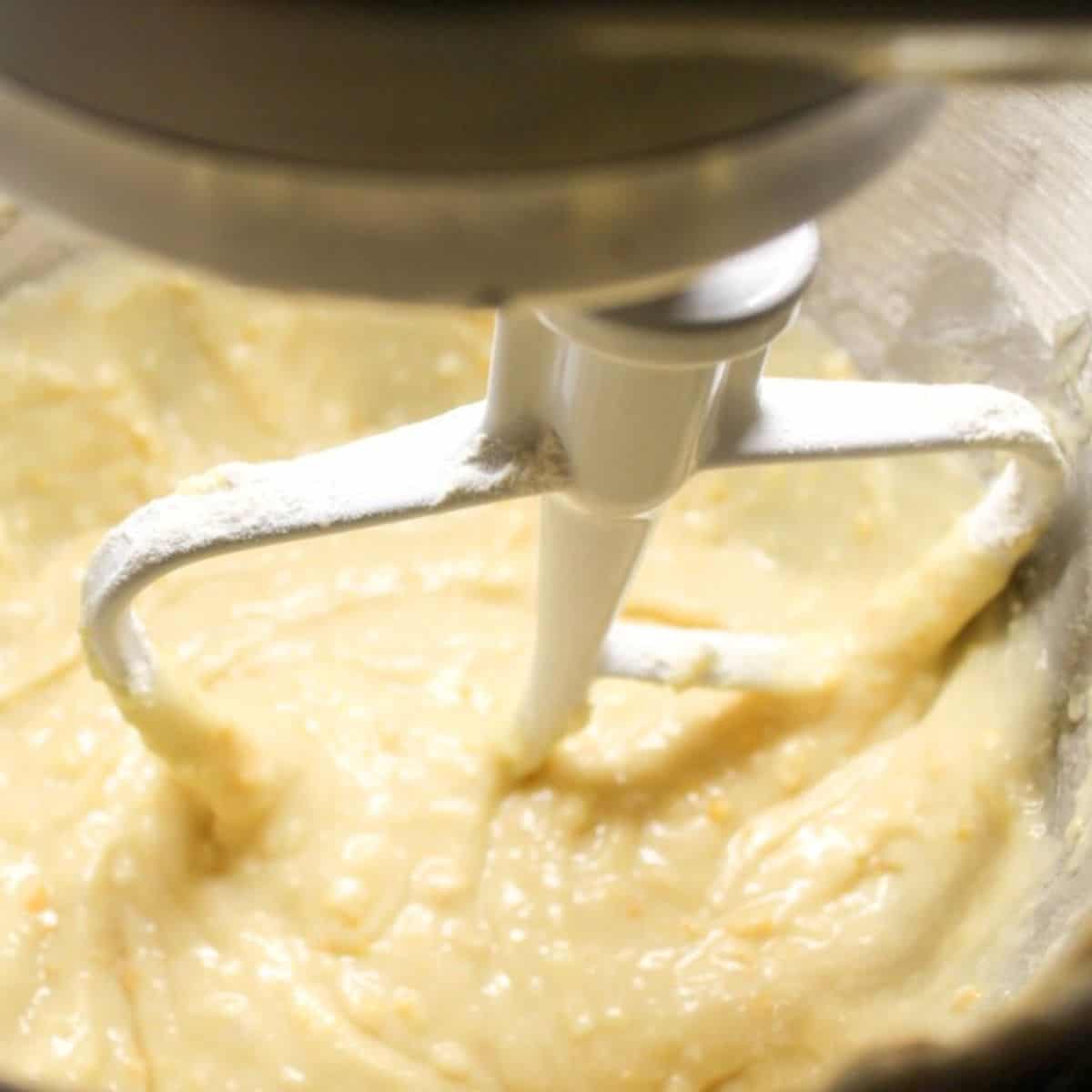 Batter mixture in a mixing bowl with beaters.