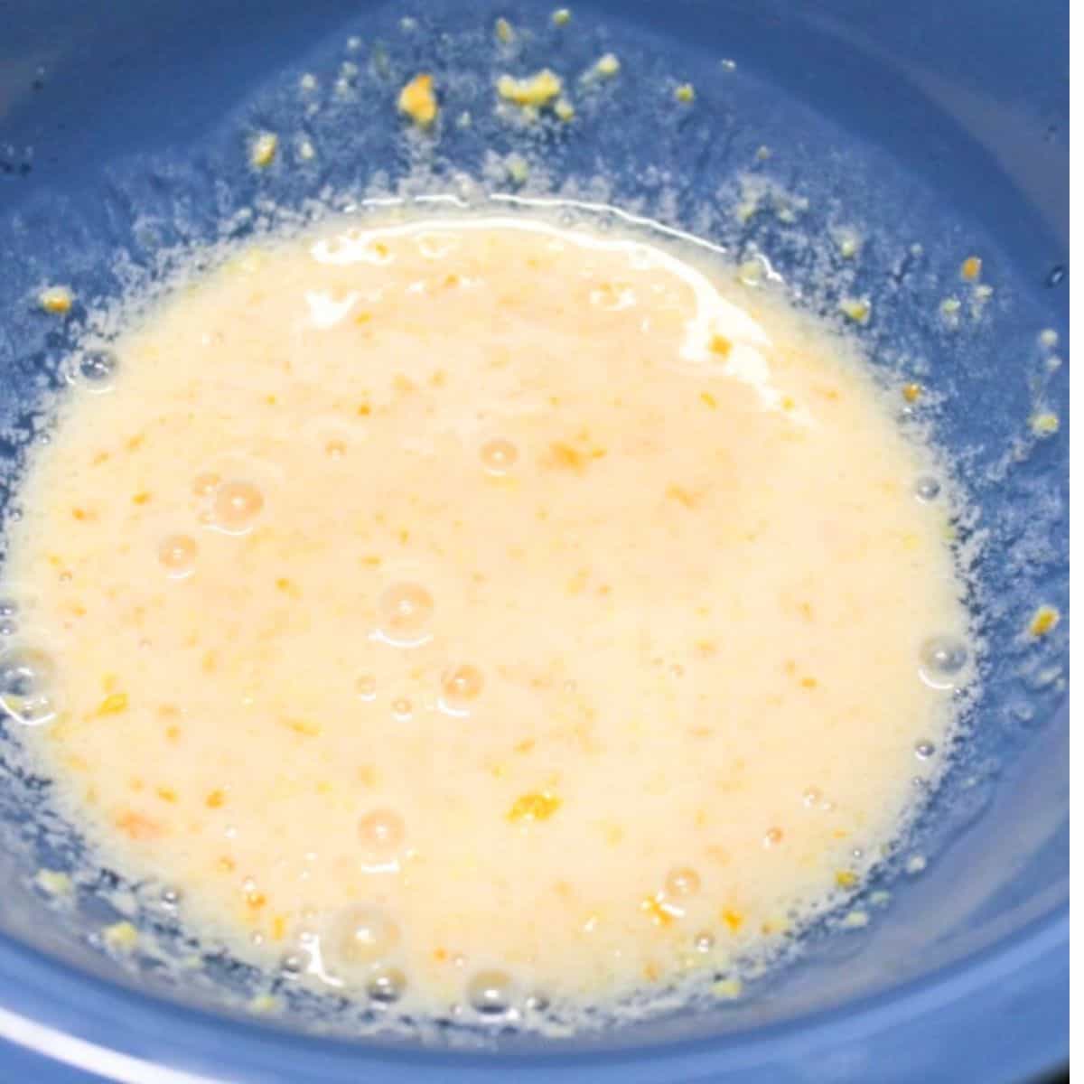 Milk mixture in a blue bowl.