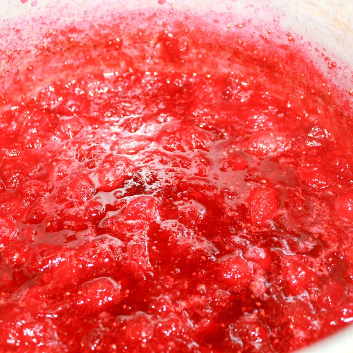 Cooked cranberry sauce in a pot.
