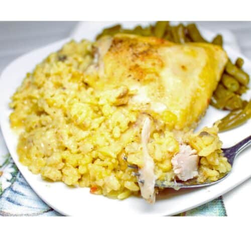 Chicken and Yellow Rice Casserole on a white plate.