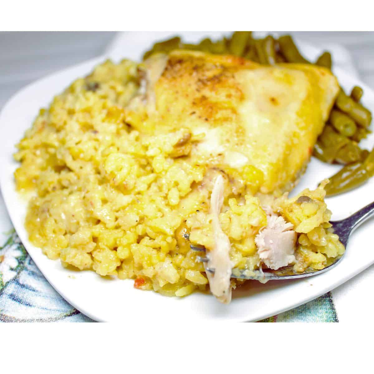 Chicken and Yellow Rice Casserole on a white plate.