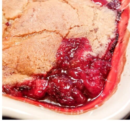 Strawberry cobbler in a baking dish with a crisp crust.