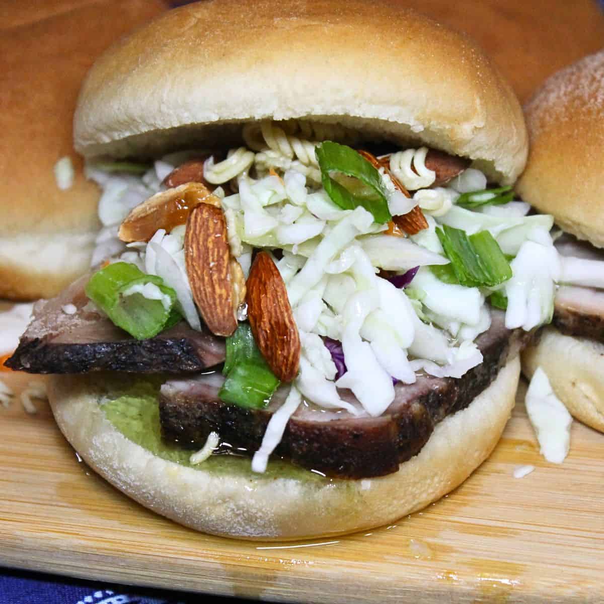 Ramen Noodle Coleslaw on top of a bbq sandwich.