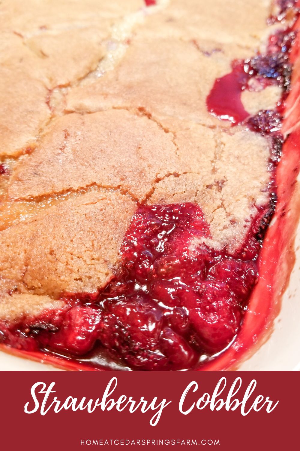 Baked homemade strawberry cobbler in a dish with text overlay. 