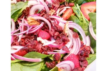 picture of strawberry spinach salad with text overlay