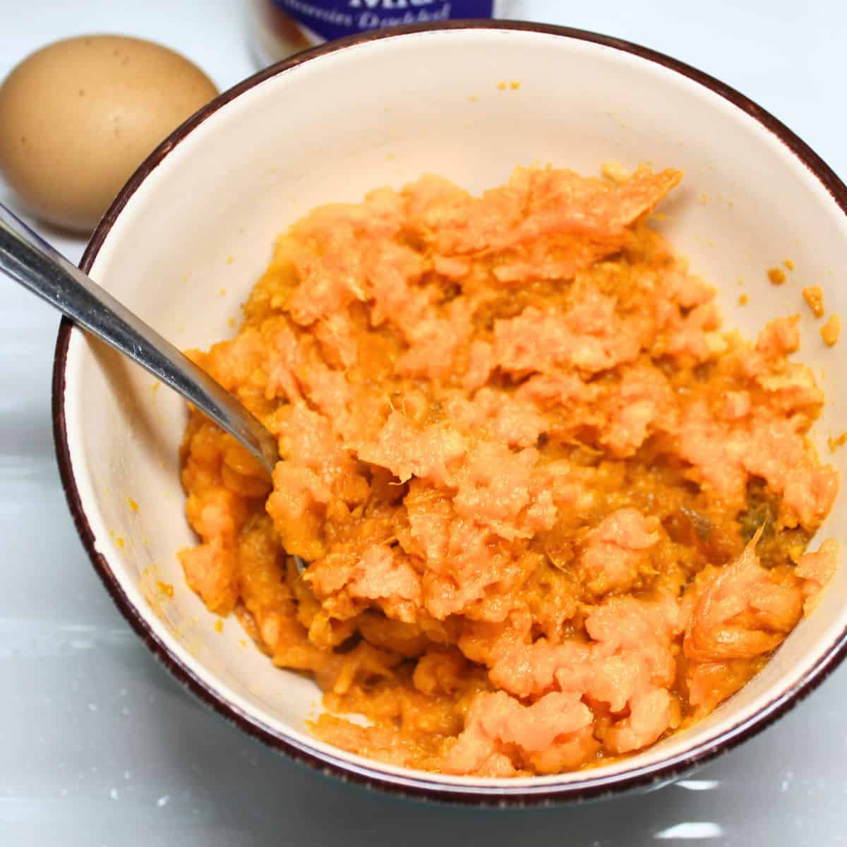 Mashed sweet potatoes in a bowl.