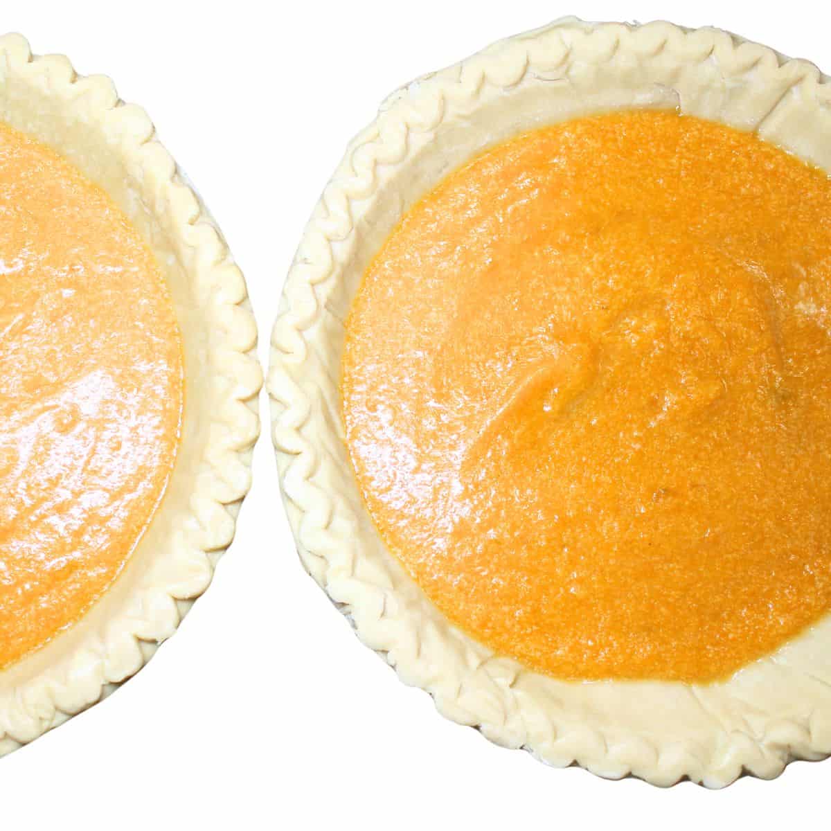 Sweet potato filling poured in two pie crusts.