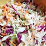 Coleslaw with vinegar in a bowl.