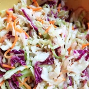Coleslaw with vinegar in a bowl.