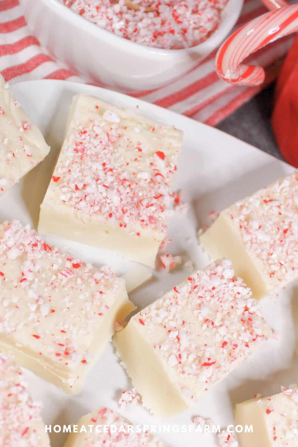 White Chocolate Peppermint Fudge on a white plate.